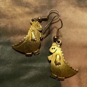 This model is giddy about wearing these little dragon earrings!!